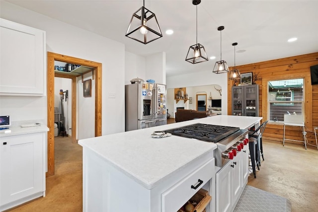 9854 N Weir Loop Cir, Austin, TX 78736 - kitchen with gas cooktop, light countertops, stainless steel fridge with ice dispenser, recessed lighting, and white cabinetry