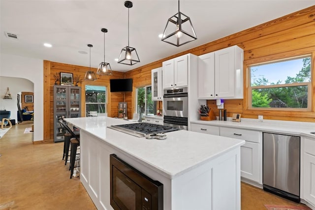 9854 N Weir Loop Cir, Austin, TX 78736 - kitchen with white cabinets, appliances with stainless steel finishes, recessed lighting, a kitchen island, and visible vents