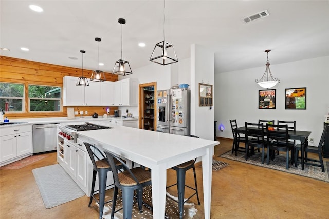 9854 N Weir Loop Cir, Austin, TX 78736 - kitchen with visible vents, a sink, white cabinets, stainless steel appliances, and recessed lighting