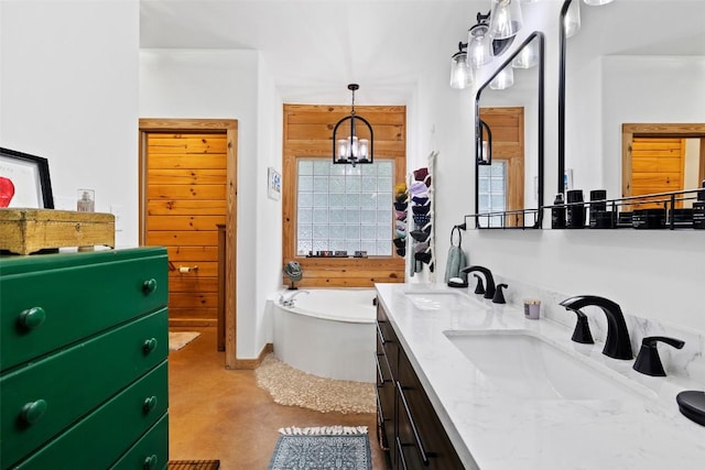 9854 N Weir Loop Cir, Austin, TX 78736 - bathroom with a sink, double vanity, concrete flooring, and a bath