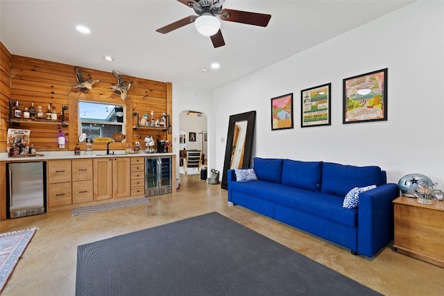 9854 N Weir Loop Cir, Austin, TX 78736 - living area with beverage cooler, finished concrete flooring, ceiling fan, and indoor wet bar