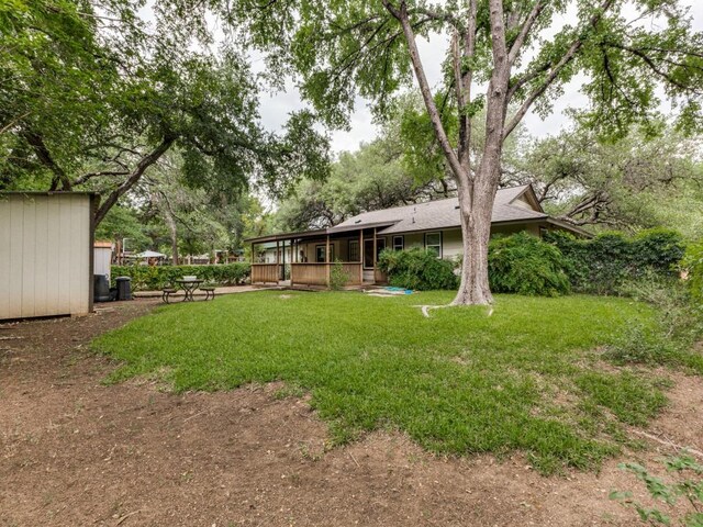 view of yard featuring a sunroom