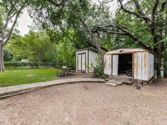 view of shed featuring fence