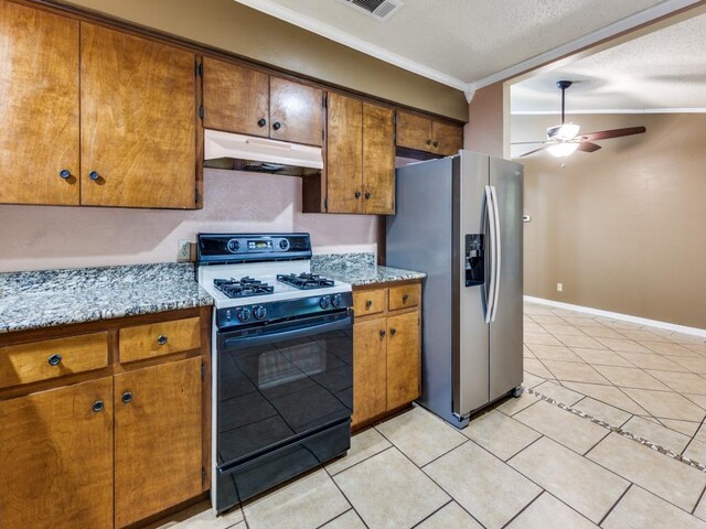kitchen featuring ceiling fan, gas stove, under cabinet range hood, stainless steel refrigerator with ice dispenser, and ornamental molding