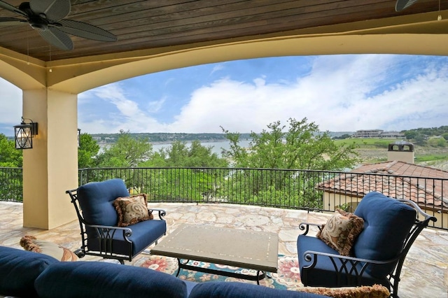 view of patio / terrace featuring ceiling fan and a balcony