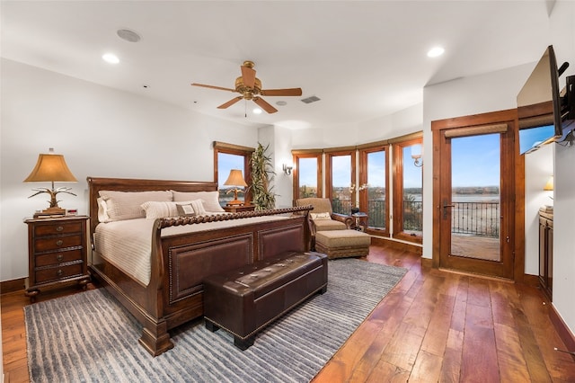 bedroom with wood-type flooring, recessed lighting, visible vents, and access to exterior