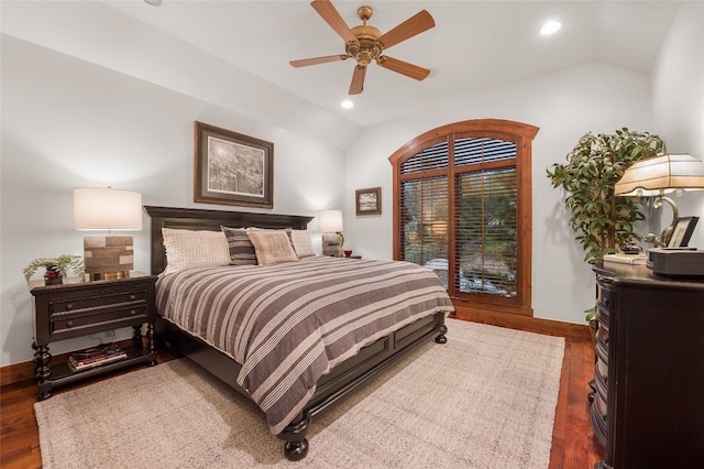 bedroom with recessed lighting, vaulted ceiling, and wood finished floors