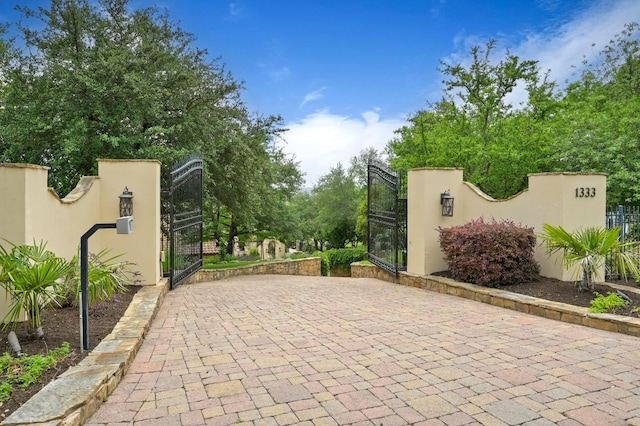 view of gate featuring fence