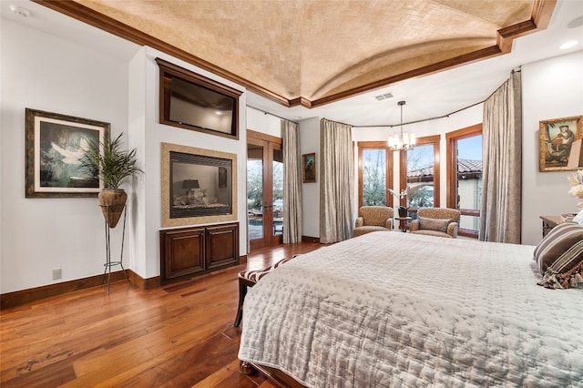 bedroom featuring visible vents, access to exterior, baseboards, dark wood-style floors, and a chandelier