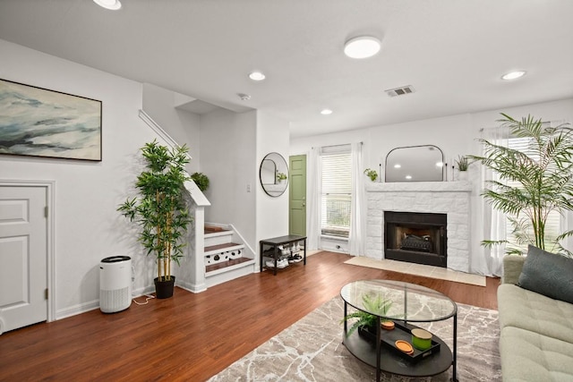 6900 E Riverside Dr Unit 17, Austin, TX 78741 - living room featuring wood finished floors, recessed lighting, and a fireplace
