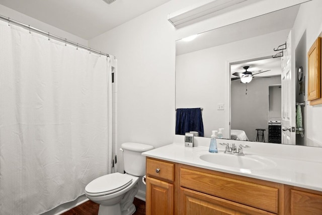 6900 E Riverside Dr Unit 17, Austin, TX 78741 - bathroom with vanity, ensuite bathroom, a ceiling fan, a shower with shower curtain, and wood finished floors