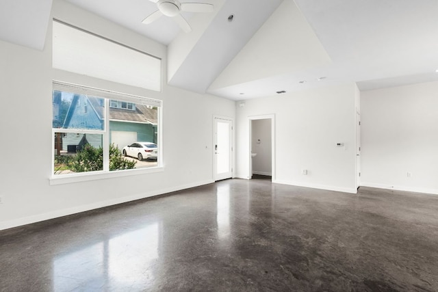 301 W Stassney Ln Unit 3, Austin, TX 78745 - unfurnished living room with concrete flooring, a ceiling fan, and a towering ceiling