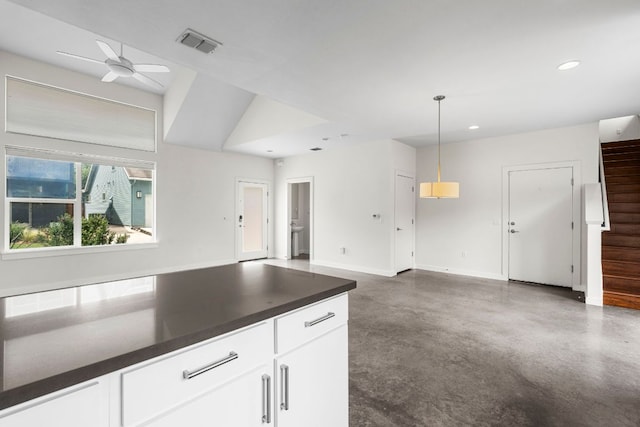 301 W Stassney Ln Unit 3, Austin, TX 78745 - kitchen with ceiling fan, finished concrete floors, recessed lighting, dark countertops, and white cabinets