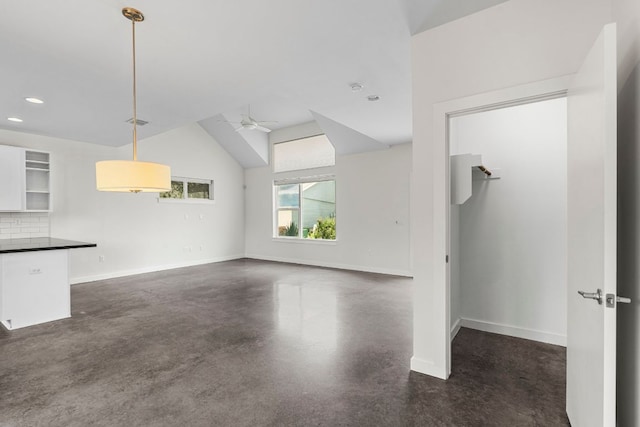 301 W Stassney Ln Unit 3, Austin, TX 78745 - unfurnished living room featuring finished concrete floors, ceiling fan, recessed lighting, and lofted ceiling