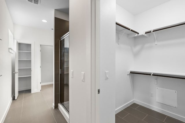 301 W Stassney Ln Unit 3, Austin, TX 78745 - walk in closet featuring dark tile patterned floors