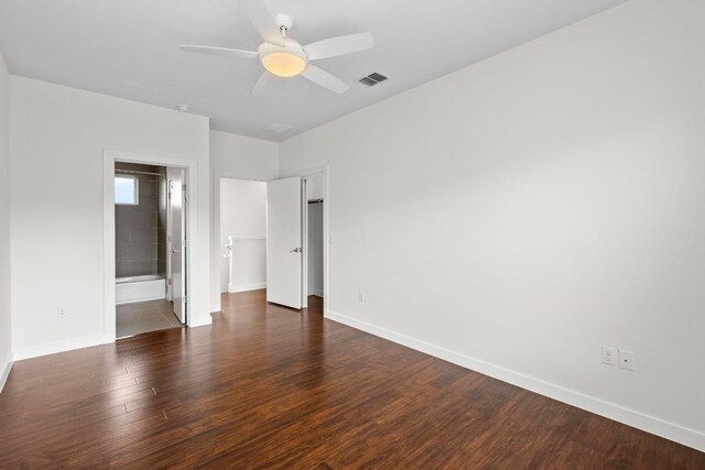 301 W Stassney Ln Unit 3, Austin, TX 78745 - unfurnished bedroom with wood finished floors, a ceiling fan, and ensuite bathroom