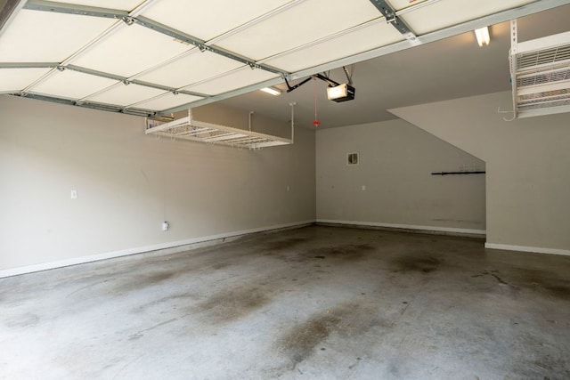 301 W Stassney Ln Unit 3, Austin, TX 78745 - garage featuring a garage door opener and baseboards