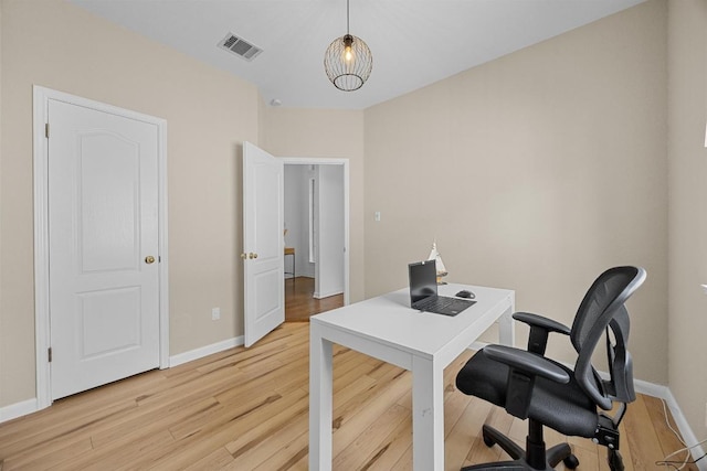 office with visible vents, light wood-style flooring, and baseboards