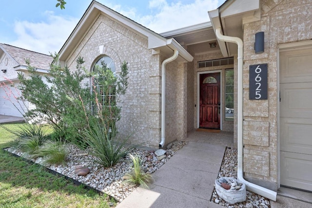entrance to property with brick siding