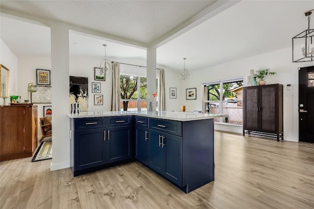1415 Mearns Meadow Blvd, Austin, TX 78758 - kitchen with a chandelier, blue cabinetry, plenty of natural light, light wood-style flooring, and beamed ceiling