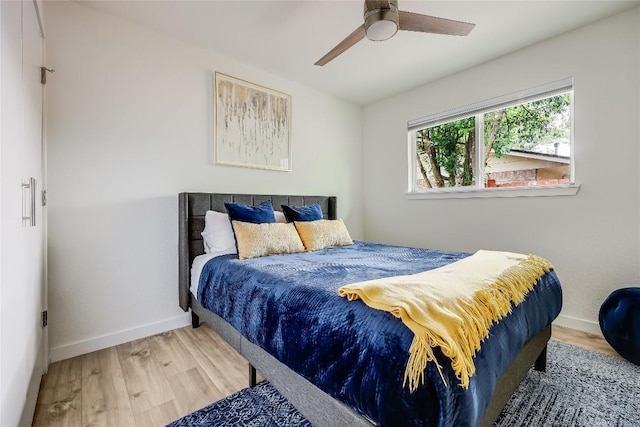 1415 Mearns Meadow Blvd, Austin, TX 78758 - bedroom featuring wood finished floors, baseboards, and a ceiling fan