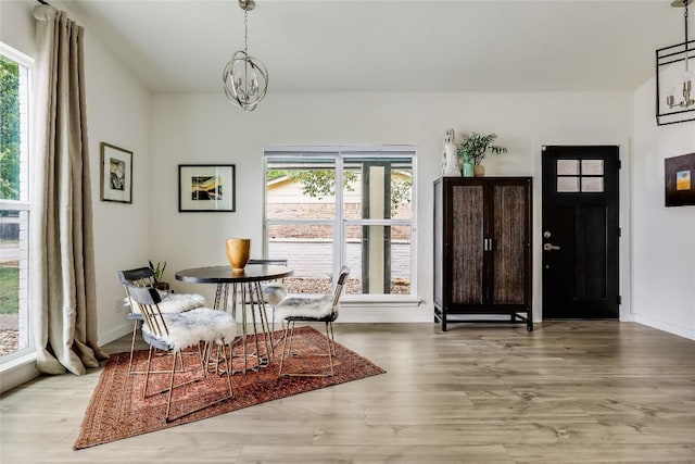 1415 Mearns Meadow Blvd, Austin, TX 78758 - foyer with healthy amount of natural light, a chandelier, wood finished floors, and baseboards