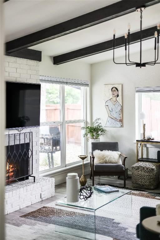 1415 Mearns Meadow Blvd, Austin, TX 78758 - living area with beam ceiling, a fireplace, and wood finished floors