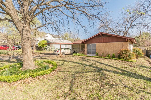 view of yard with an attached carport