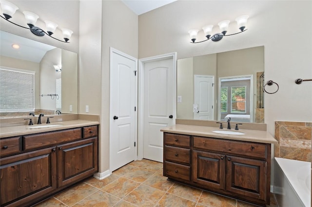 2420 Champions Corner Dr, Leander, TX 78641 - full bath featuring a bath and two vanities