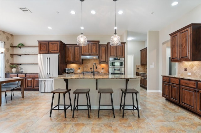 2420 Champions Corner Dr, Leander, TX 78641 - kitchen with stainless steel appliances, open shelves, tasteful backsplash, light stone countertops, and recessed lighting
