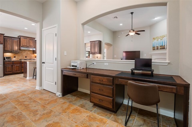 2420 Champions Corner Dr, Leander, TX 78641 - office area featuring a ceiling fan, recessed lighting, arched walkways, baseboards, and built in desk