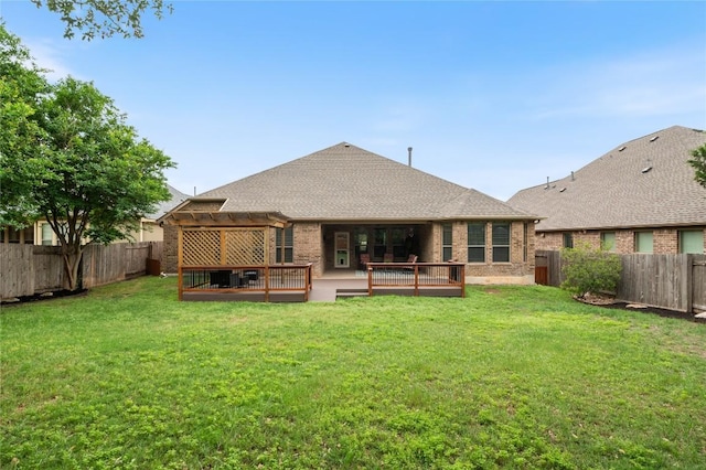 2420 Champions Corner Dr, Leander, TX 78641 - rear view of property with a pergola, brick siding, a deck, and roof with shingles