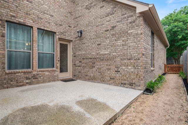 2420 Champions Corner Dr, Leander, TX 78641 - doorway to property featuring a patio and brick siding