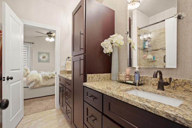 581 Demarett Dr, Point Venture, TX 78645 - full bath featuring vanity, ensuite bathroom, tiled shower, and ceiling fan