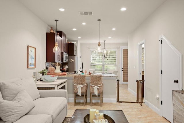 581 Demarett Dr, Point Venture, TX 78645 - living area with recessed lighting and a chandelier