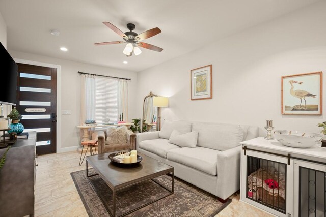 living area with a ceiling fan, baseboards, and recessed lighting
