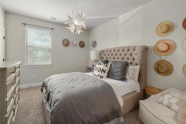 581 Demarett Dr, Point Venture, TX 78645 - bedroom featuring light colored carpet, a chandelier, and baseboards