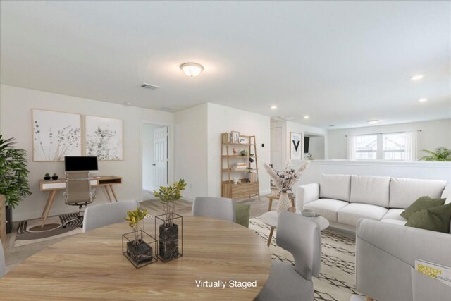 living room featuring recessed lighting and visible vents