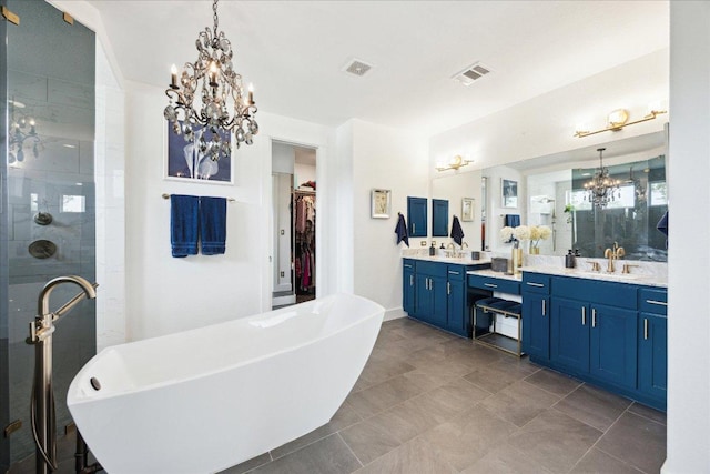 full bath featuring an inviting chandelier, visible vents, and a shower stall
