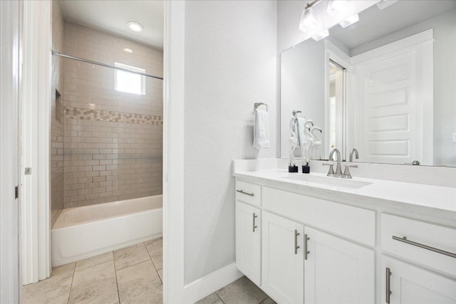 full bath with vanity, tile patterned floors, baseboards, and shower / bathtub combination