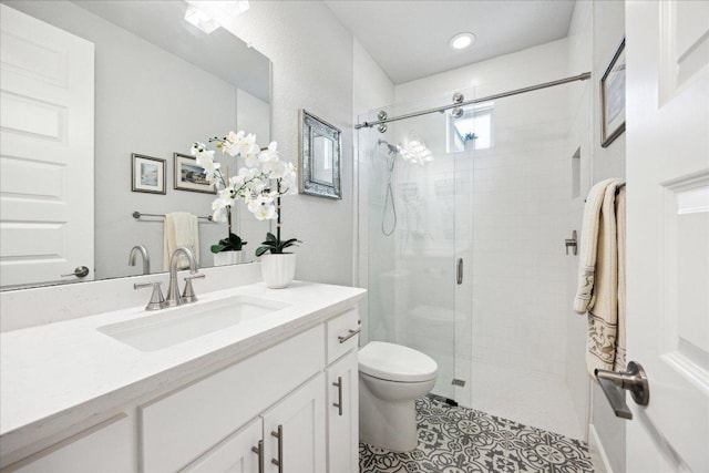 2201 Live Oak Rd, Leander, TX 78641 - full bathroom featuring vanity, a stall shower, toilet, tile patterned flooring, and recessed lighting