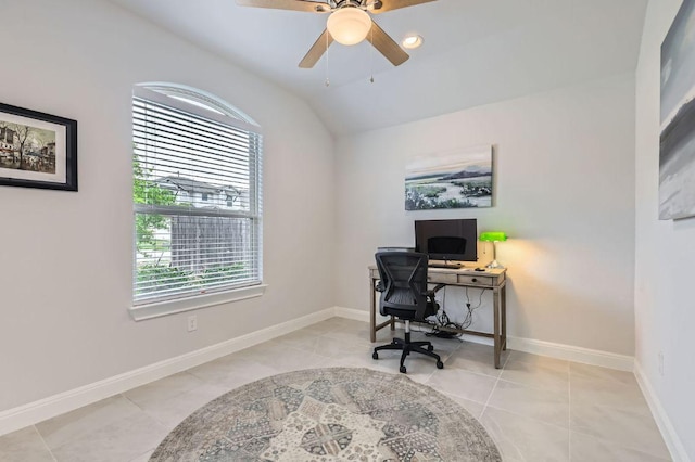 tiled office with baseboards, a ceiling fan, and lofted ceiling