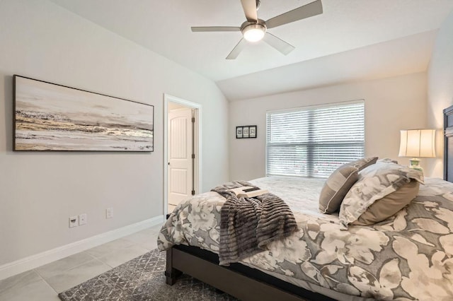 bedroom with baseboards, ceiling fan, lofted ceiling, and light tile patterned flooring