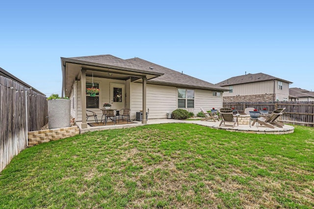 304 La Joya Pass, Leander, TX 78641 - rear view of property with a patio and an outdoor fire pit