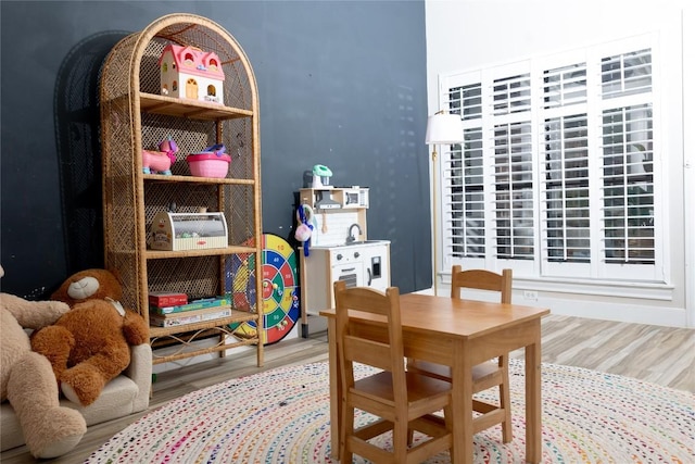 dining area with wood finished floors