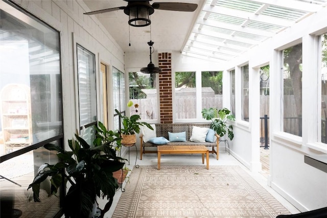 sunroom featuring lofted ceiling