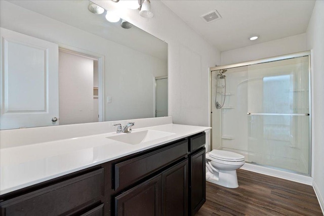 516 Peony Ct, Jarrell, TX 76537 - full bath with toilet, a stall shower, wood finished floors, and vanity
