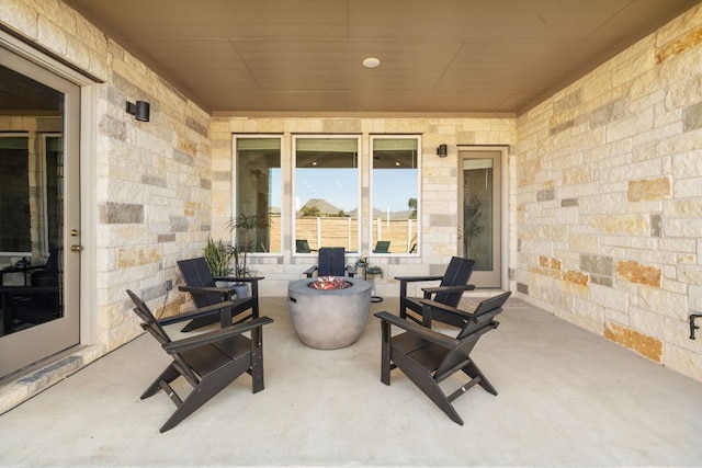 view of patio / terrace with an outdoor fire pit
