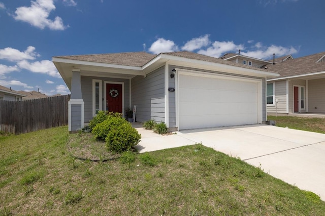 view of front facade featuring a garage, fence, concrete driveway, and a front lawn