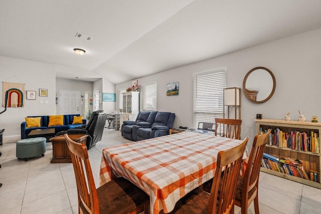 dining space with visible vents and light tile patterned floors